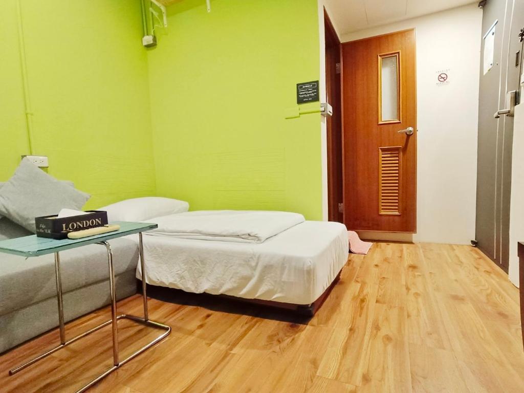 Postel nebo postele na pokoji v ubytování 東海小時光 Tong Hai Time Homestay