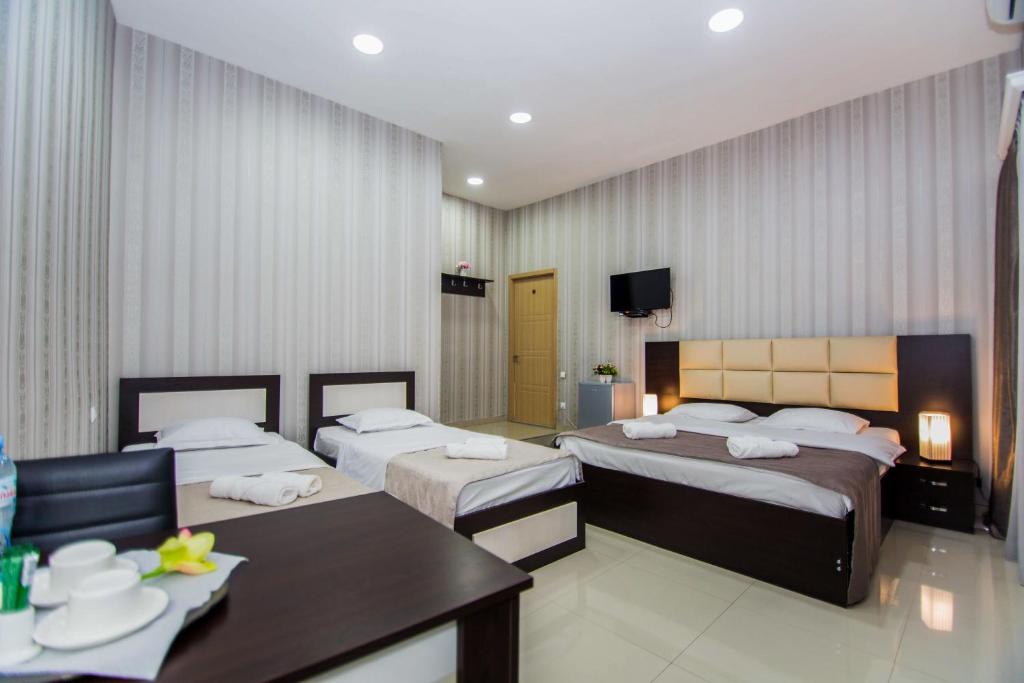 Postel nebo postele na pokoji v ubytování Hotel Care Inn