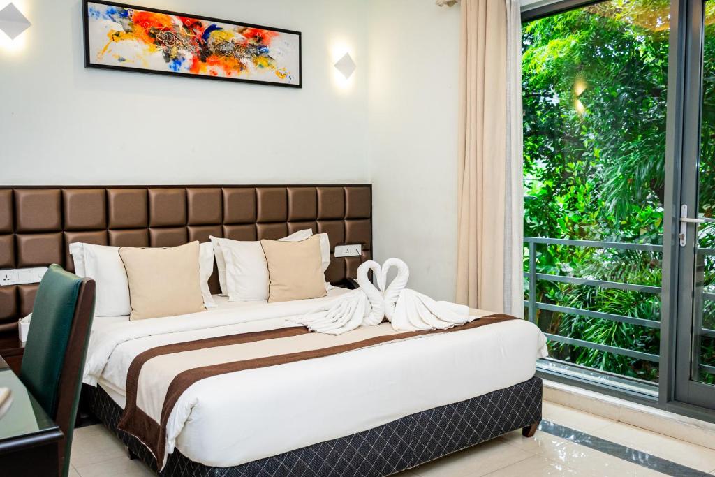 Postel nebo postele na pokoji v ubytování Viveka Hotel Colombo
