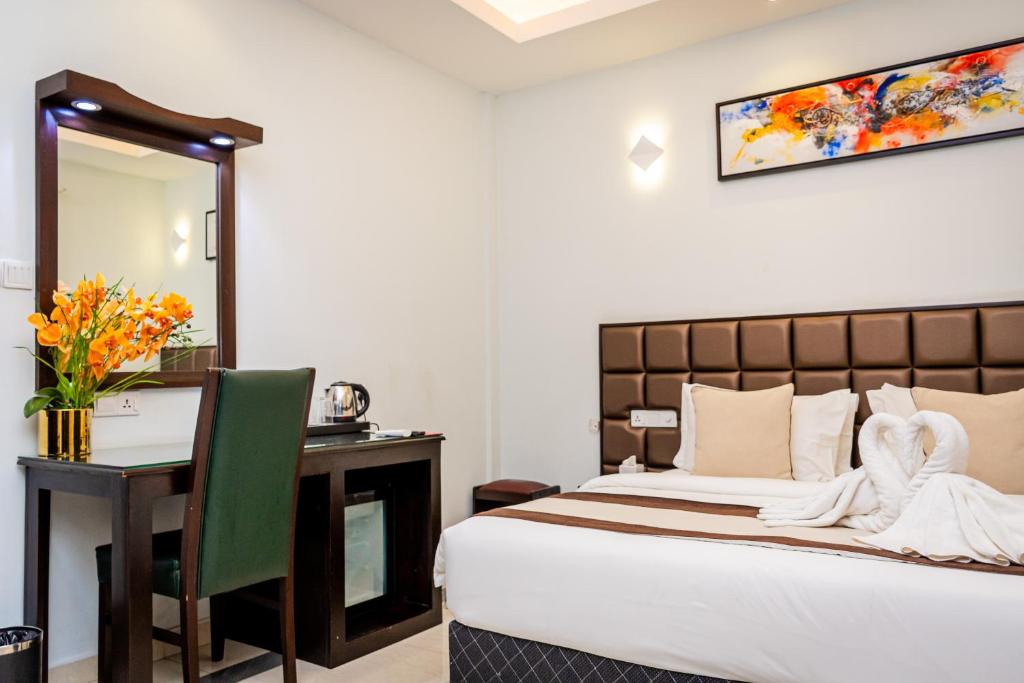 Postel nebo postele na pokoji v ubytování Viveka Hotel Colombo