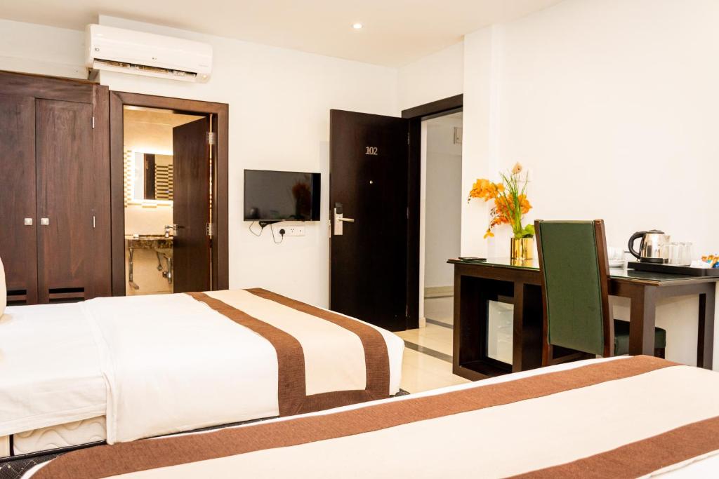 Postel nebo postele na pokoji v ubytování Viveka Hotel Colombo