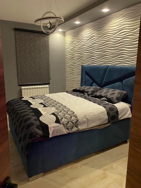 Postel nebo postele na pokoji v ubytování Apartman Andrej