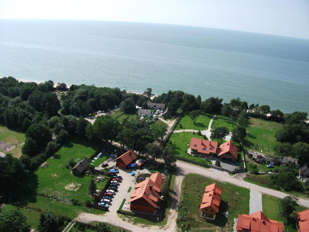 an aerial view of a resort next to the water at Karkle Beach Apartments in Karklė