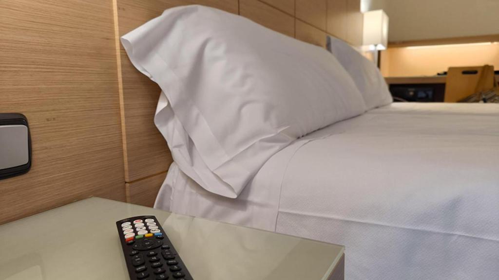 Postel nebo postele na pokoji v ubytování Hotel Condes de Haro