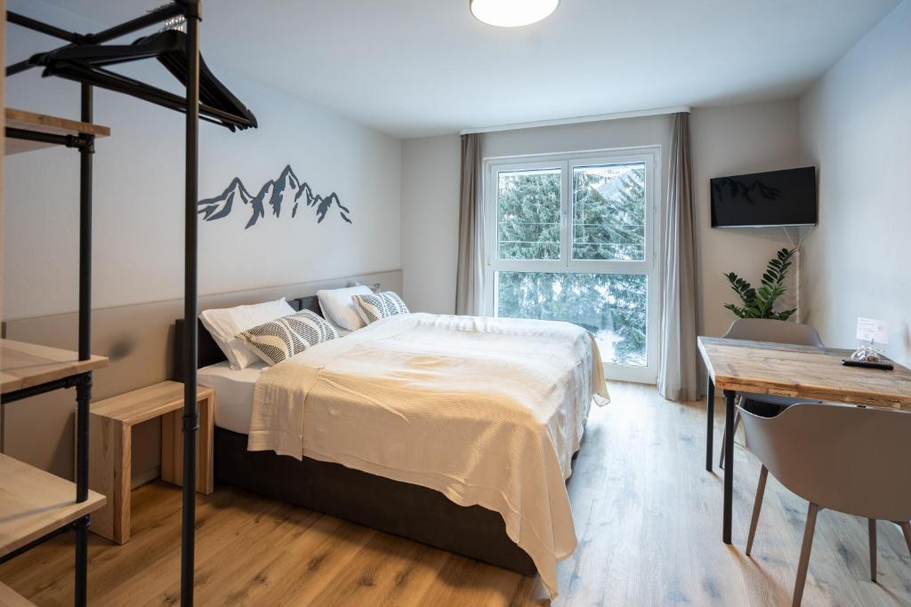 Postel nebo postele na pokoji v ubytování Studio 54 Davos
