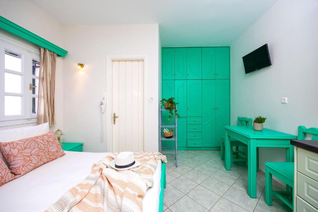 Postel nebo postele na pokoji v ubytování Sahara Beach Apartments - Kastraki