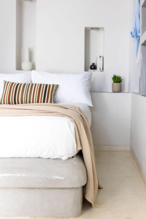 Postel nebo postele na pokoji v ubytování Sahara Beach Apartments - Kastraki