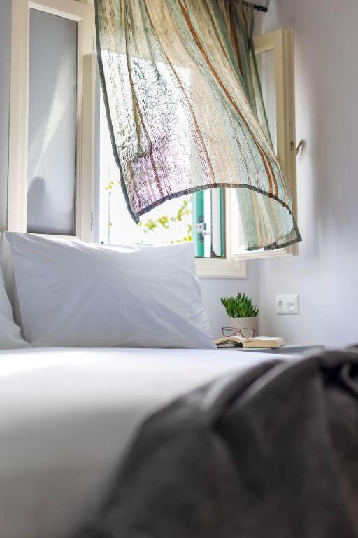 Postel nebo postele na pokoji v ubytování Sahara Beach Apartments - Kastraki