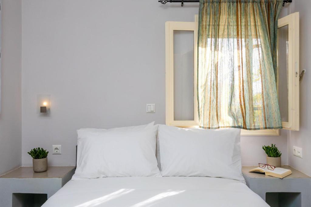 Postel nebo postele na pokoji v ubytování Sahara Beach Apartments - Kastraki