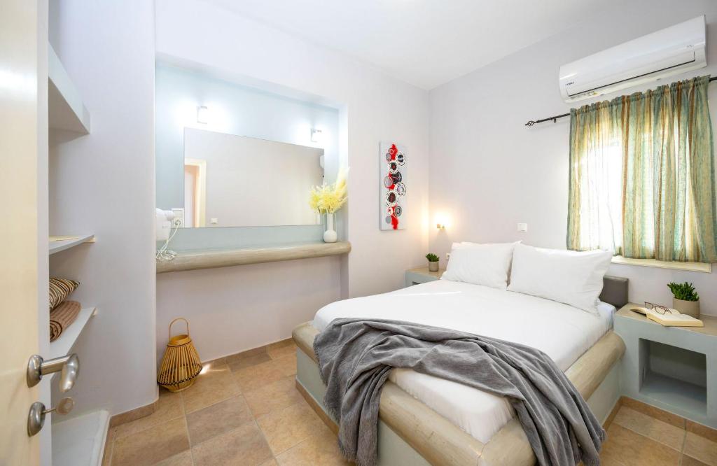Postel nebo postele na pokoji v ubytování Sahara Beach Apartments - Kastraki