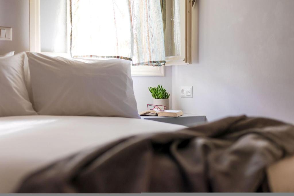 Postel nebo postele na pokoji v ubytování Sahara Beach Apartments - Kastraki