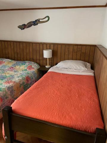 En eller flere senge i et værelse på Bahiano