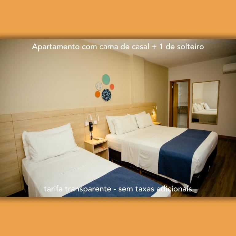 Postel nebo postele na pokoji v ubytování Luds Comfort Hotel