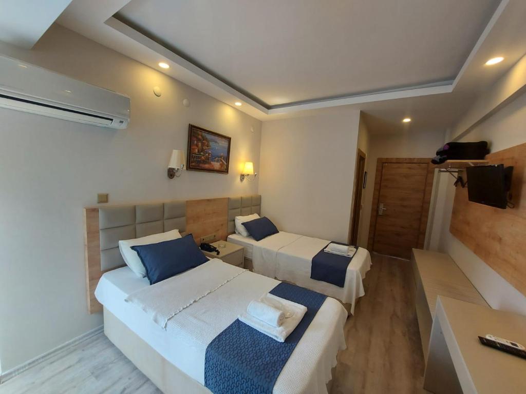 Postel nebo postele na pokoji v ubytování Afsin Hotel
