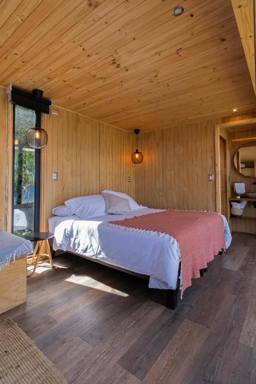 Postel nebo postele na pokoji v ubytování OUTSCAPE l Cabañas Lago Puyehue