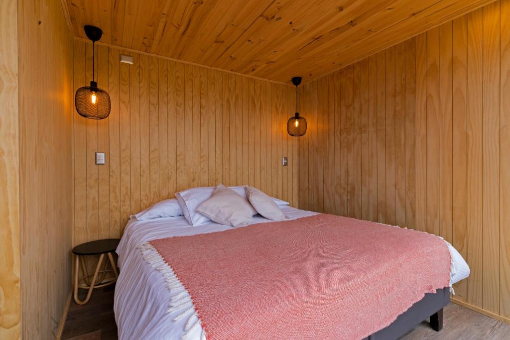Postel nebo postele na pokoji v ubytování OUTSCAPE l Cabañas Lago Puyehue