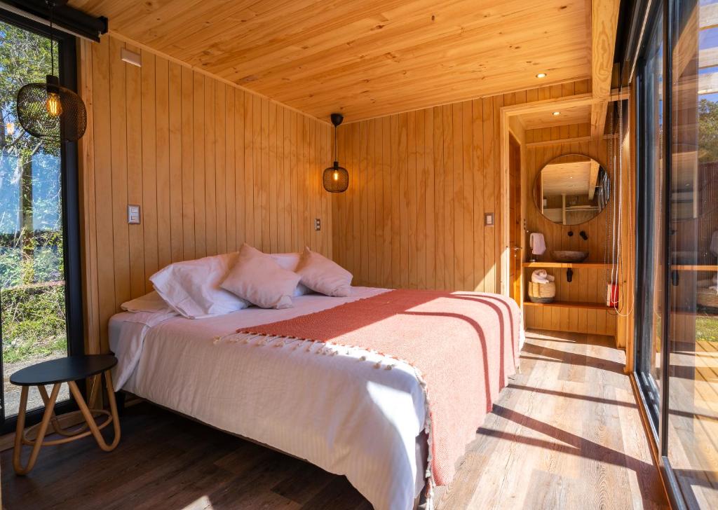 Postel nebo postele na pokoji v ubytování OUTSCAPE l Cabañas Lago Puyehue