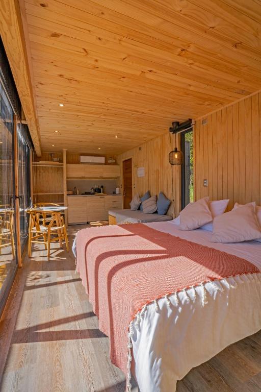 Postel nebo postele na pokoji v ubytování OUTSCAPE l Cabañas Lago Puyehue