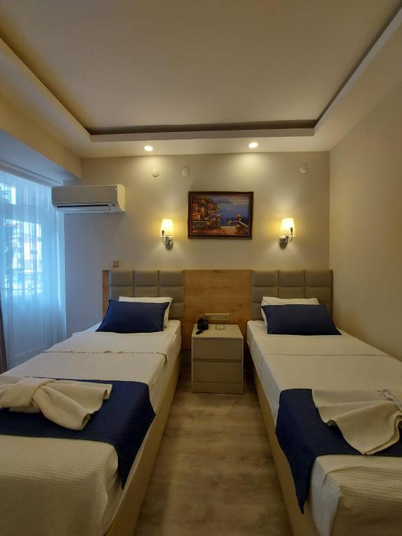 Postel nebo postele na pokoji v ubytování Afsin Hotel