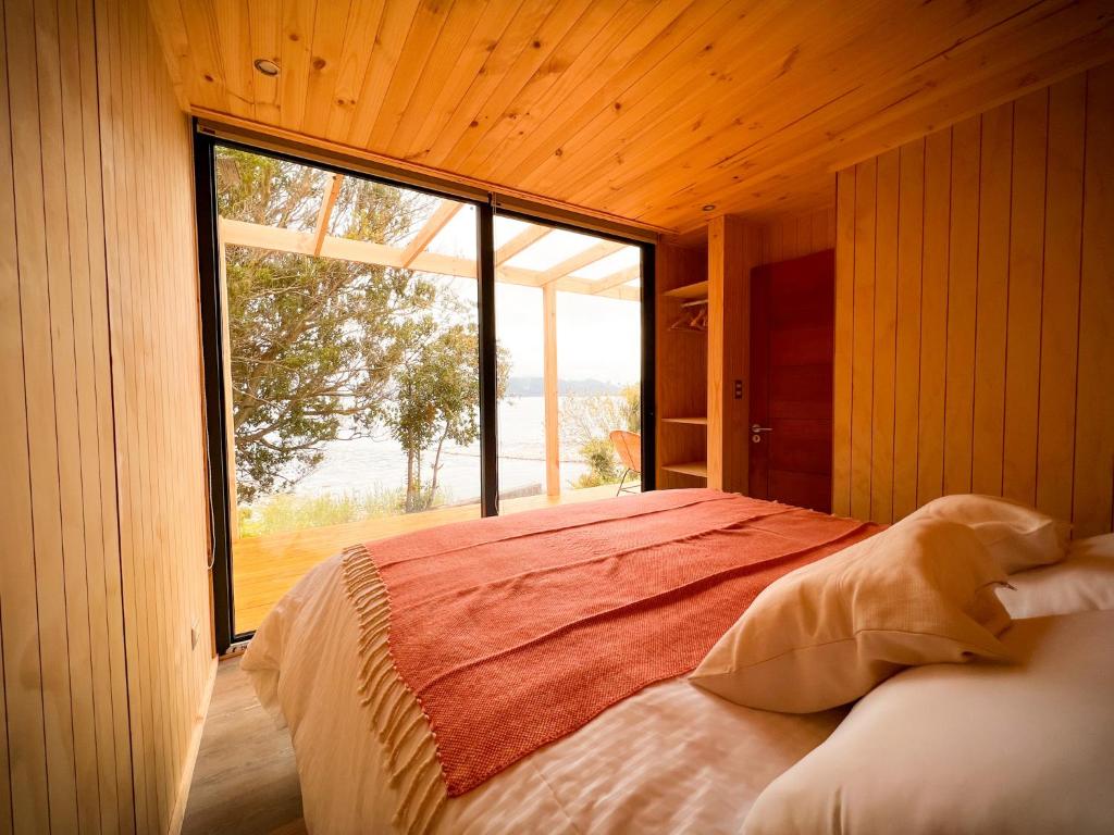 Postel nebo postele na pokoji v ubytování OUTSCAPE l Cabañas Lago Puyehue