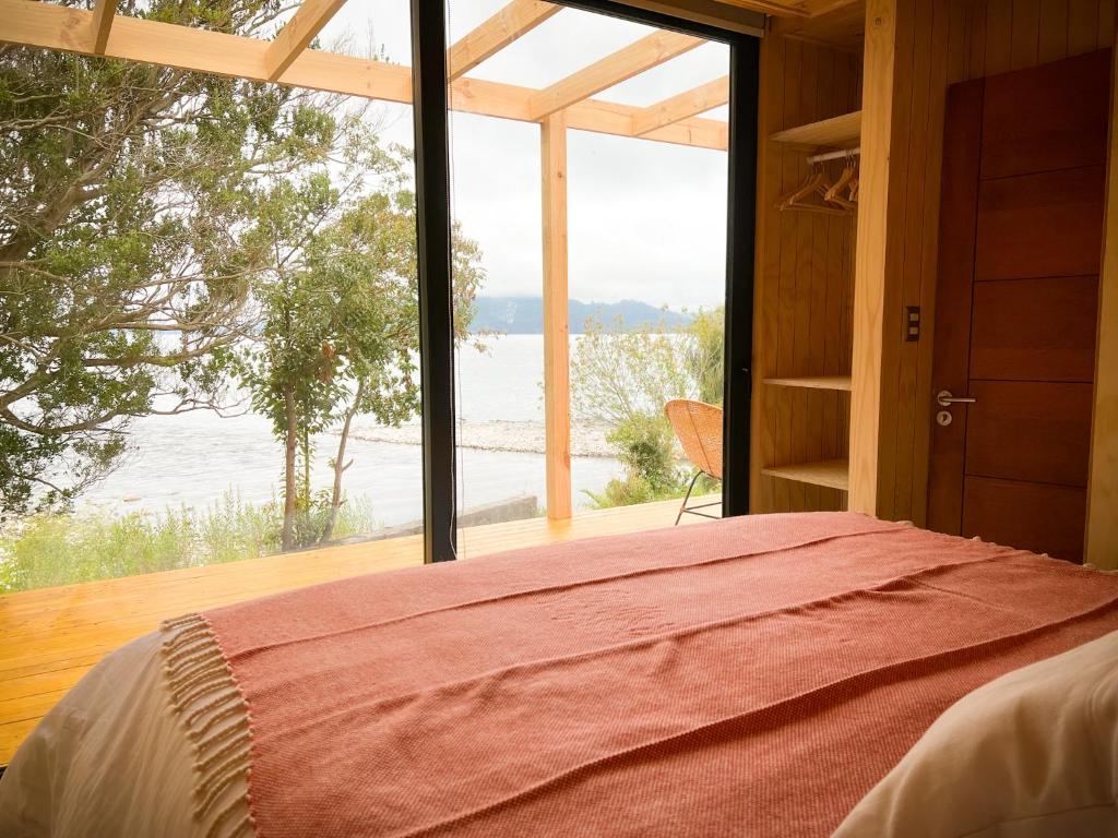 Postel nebo postele na pokoji v ubytování OUTSCAPE l Cabañas Lago Puyehue