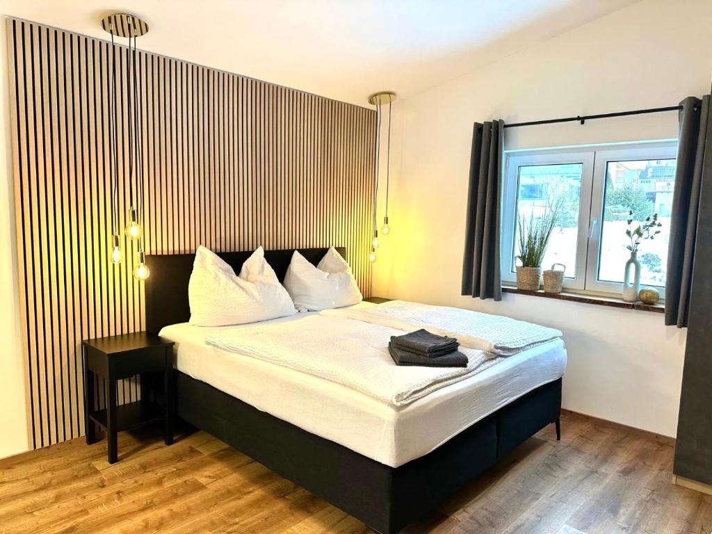 Postel nebo postele na pokoji v ubytování AlpLoft Apartment Top1