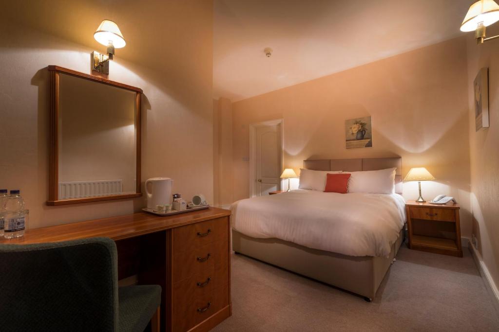 Postel nebo postele na pokoji v ubytování Petwood Hotel