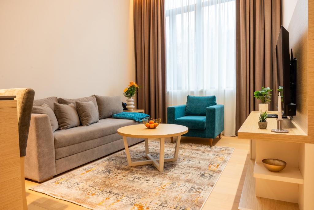 a living room with a couch and a table at Apartman Dunja Zepterme in Vrnjačka Banja
