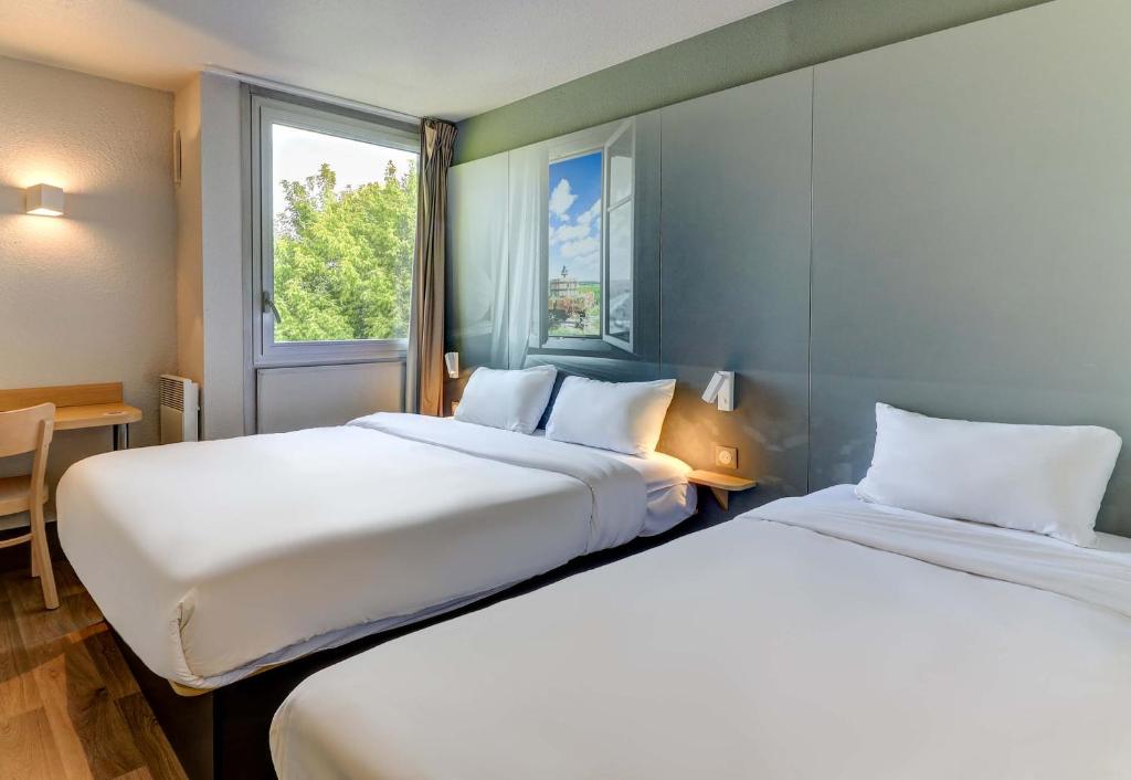 Postel nebo postele na pokoji v ubytování B&B HOTEL Beaune Sud 1 Palais des Congrès