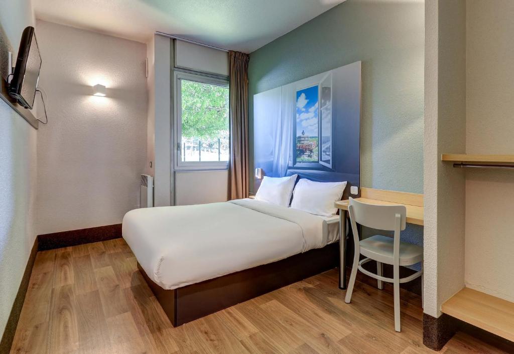 Postel nebo postele na pokoji v ubytování B&B HOTEL Beaune Sud 1 Palais des Congrès