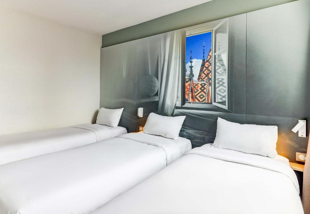 Postel nebo postele na pokoji v ubytování B&B HOTEL Beaune Sud 1 Palais des Congrès