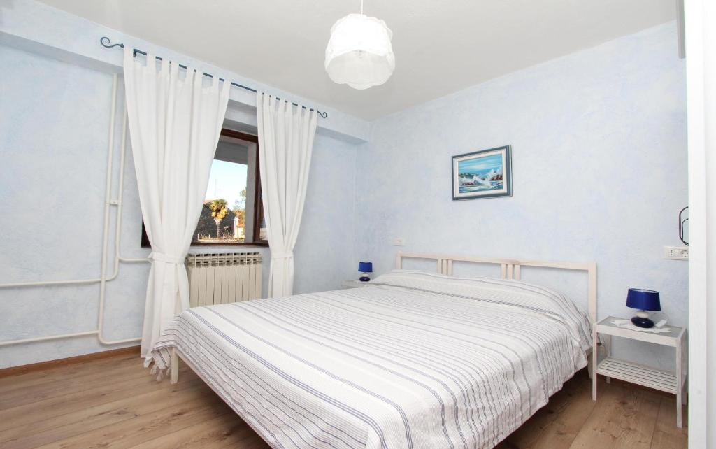 Posteľ alebo postele v izbe v ubytovaní Apartments Midea 2
