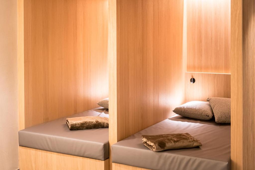 Postel nebo postele na pokoji v ubytování Kronplatz-Resort Hotel Kristall