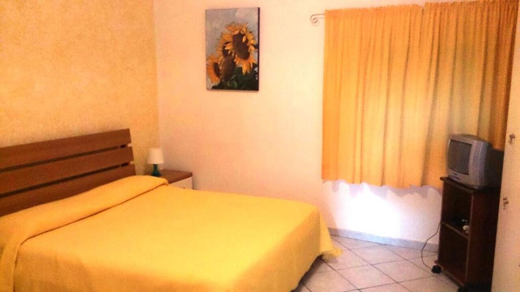 Postel nebo postele na pokoji v ubytování Hotel B&B Rispescia Grosseto