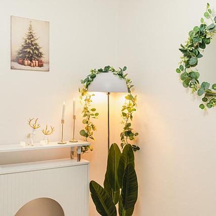 a living room with a lamp and a christmas tree at Noddle Sun Stay in Seoul