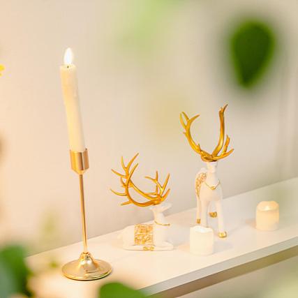 a candle and some antlers on a shelf at Noddle Sun Stay in Seoul