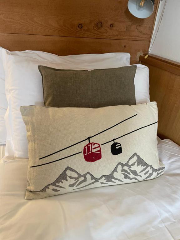 Postel nebo postele na pokoji v ubytování Hotel Valle Verde - Rent Ski & Bike