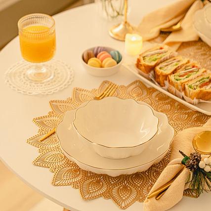 a table with a plate of food and a glass of orange juice at Noddle Sun Stay in Seoul