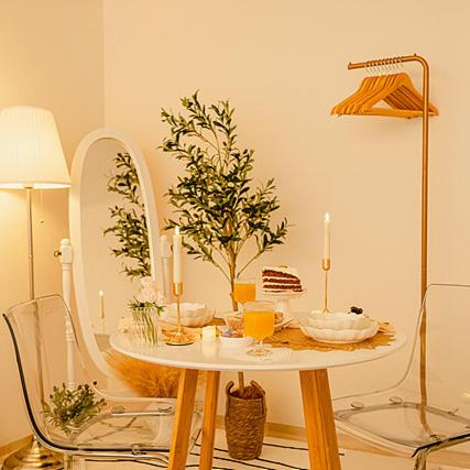 a table with a mirror and a table with candles on it at Noddle Sun Stay in Seoul