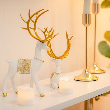 a white shelf with some deer figurines on it at Noddle Sun Stay in Seoul