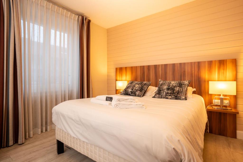 Postel nebo postele na pokoji v ubytování Hôtel La Réserve