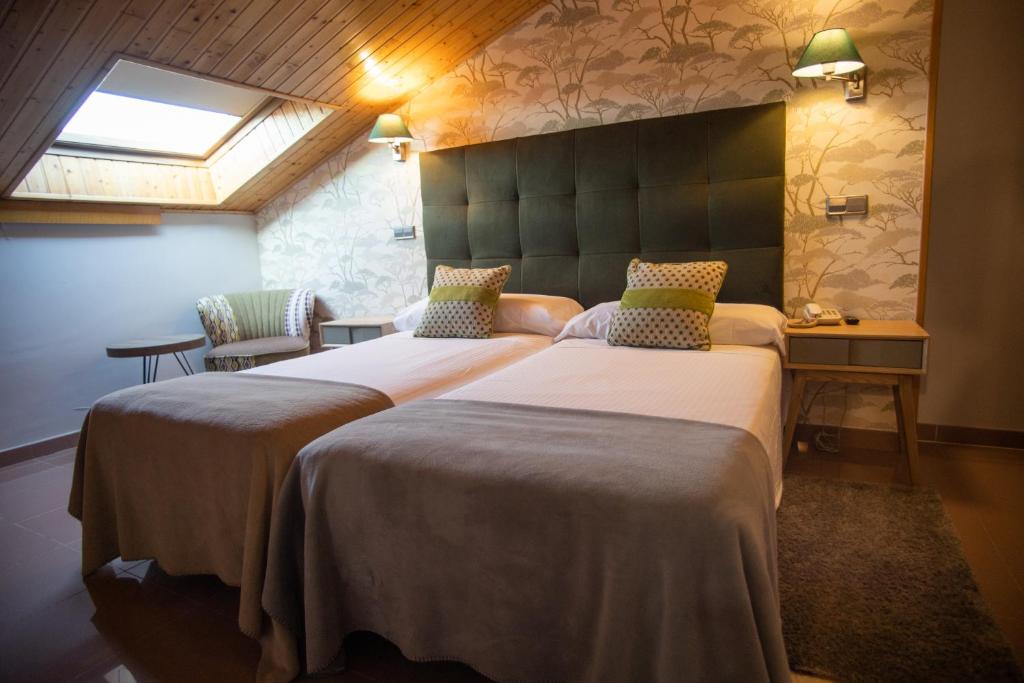 Postel nebo postele na pokoji v ubytování Hotel Las Moradas