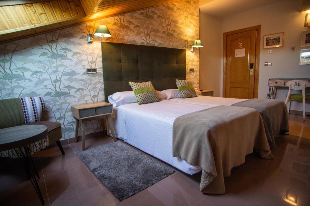 Postel nebo postele na pokoji v ubytování Hotel Las Moradas