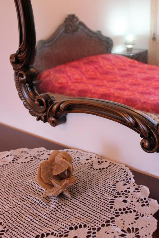 a stuffed animal sitting on top of a bed at Discover Italy in Tignes