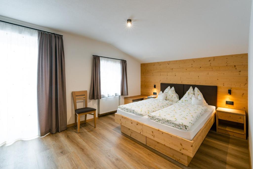 Postel nebo postele na pokoji v ubytování Garni Edera