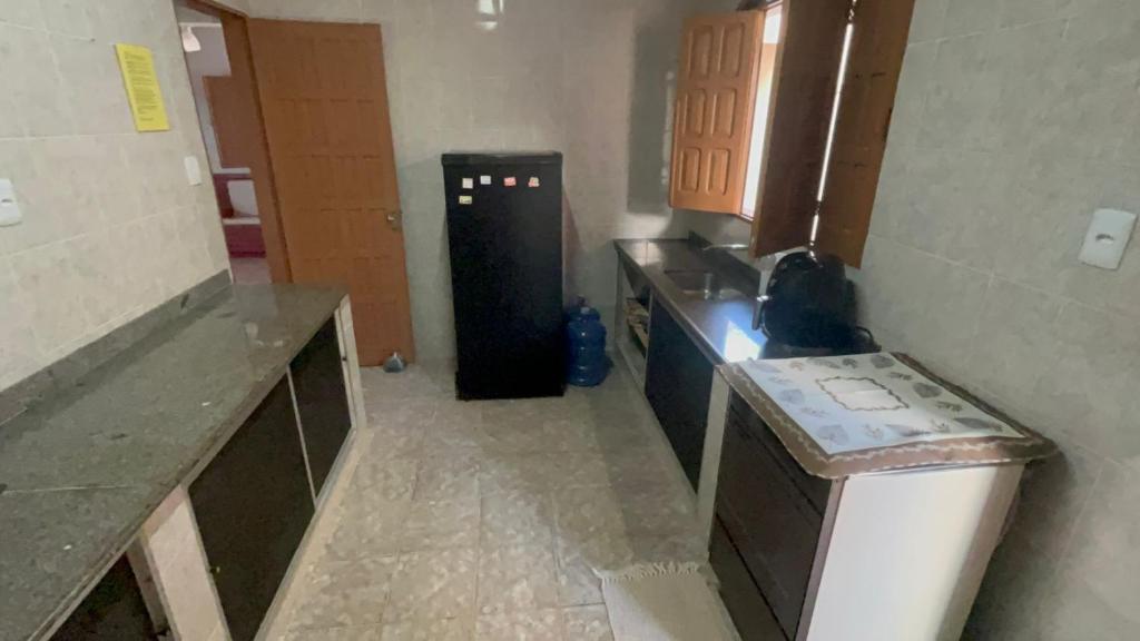 Kuchyň nebo kuchyňský kout v ubytování Casa Praia Guriri