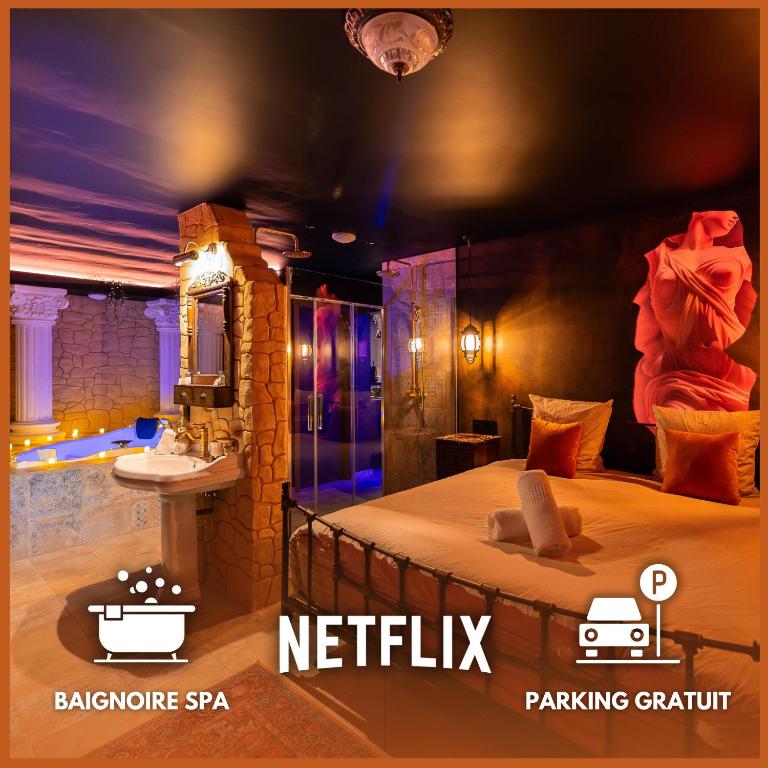 une chambre avec un lit et une salle de bain avec un lavabo dans l'établissement La Suite de Vénus - Chambre à thème Love Room Jacuzzi et Pièce Secrète - Évasion pour deux, à Schirrhein
