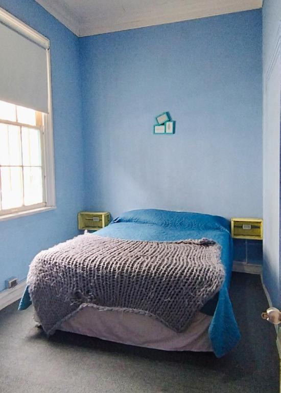 Postel nebo postele na pokoji v ubytování Hostal Perro Watón