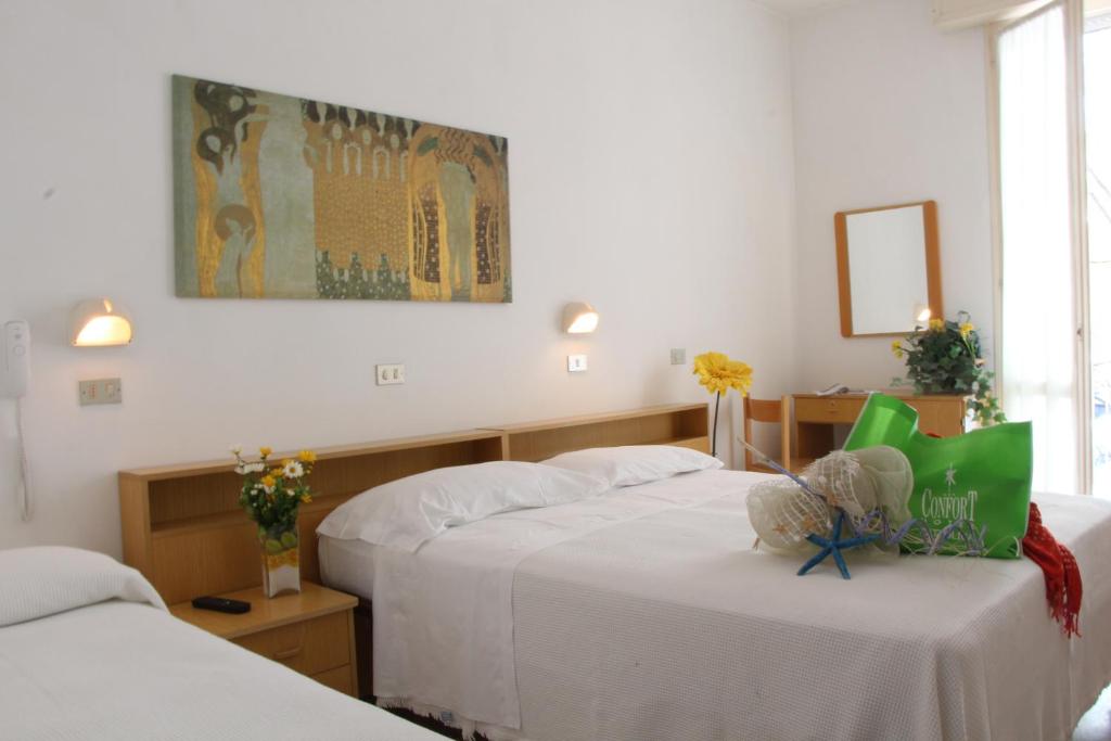 Postel nebo postele na pokoji v ubytování Hotel Confort