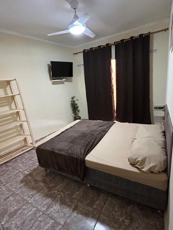 Postel nebo postele na pokoji v ubytování Suite dos anjos